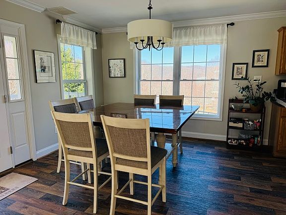 Dining area beside kitchen showcasing beautiful mountain views while you eat!