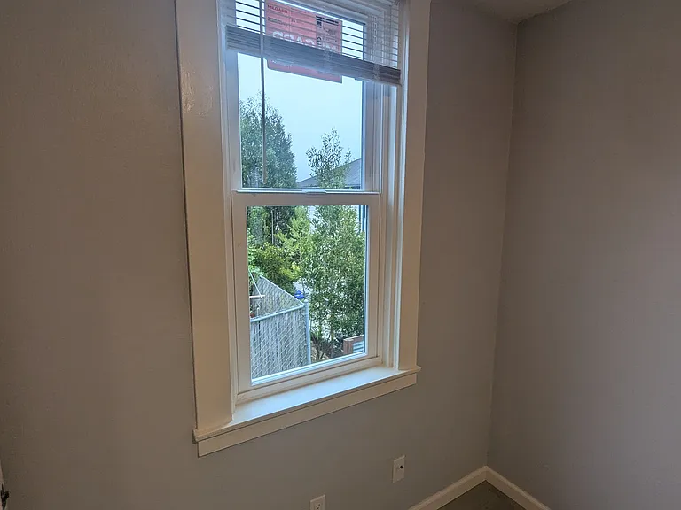 Bedroom side window (2 windows in bedroom).