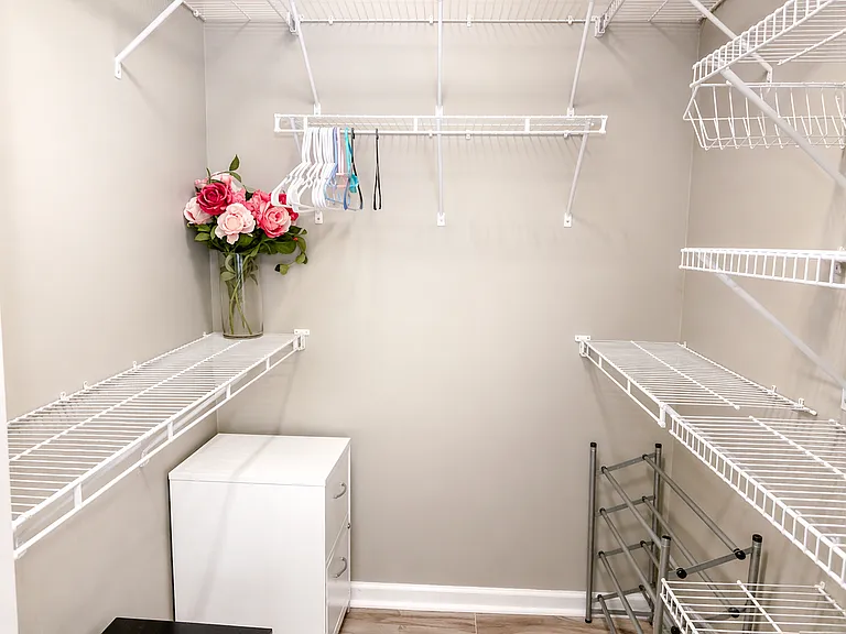 Large, spacious walk-in closet with ample storage.