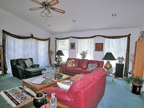 Spacious living room with french doors leading to small deck