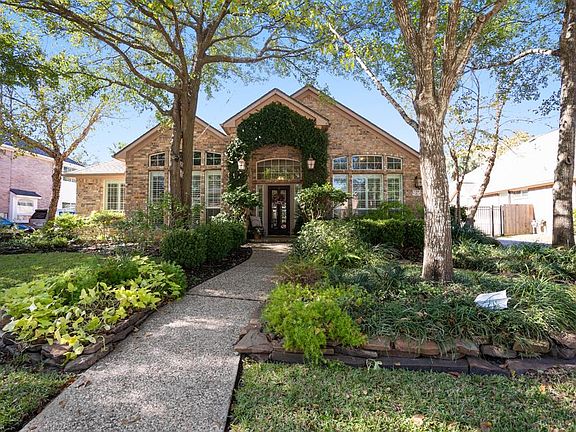 This gorgeous 1 story home built by Coventry has a 2 car oversized garage, a private wrought iron driveway gate that leads to an incredible backyard.