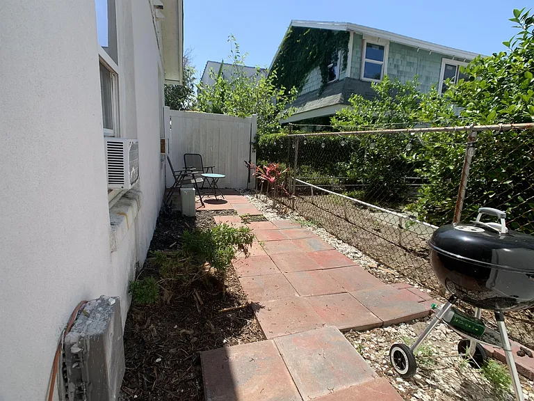 Private, gated and fenced side yard.
