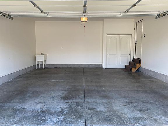 Two car garage with a shoe closet near the door.