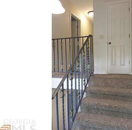 View from Two-Story Foyer to the Upstairs Hall.