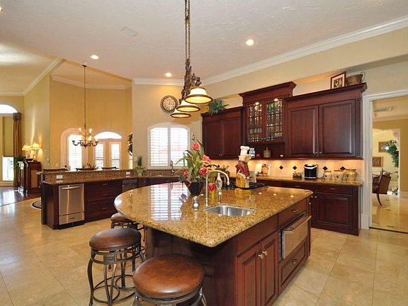 One view of the huge kitchen with large island & SS appliances
