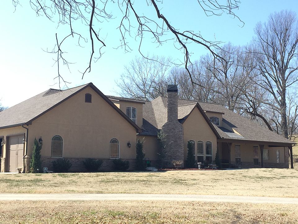 This beautiful home sits on a beautiful 5 acre lot with mature trees, your very own private pond and creek and an awesome rolling hill landscape