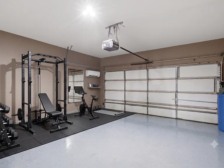 two car garage with mini-split AC - staged as home gym