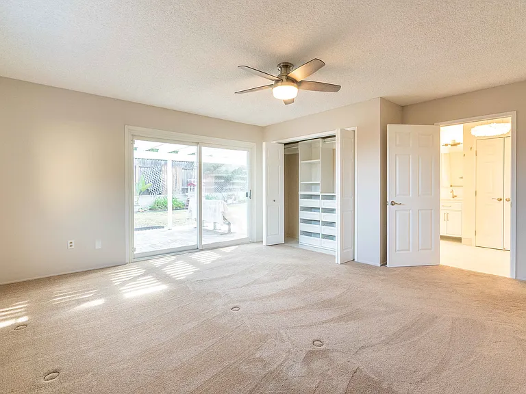 Master bedroom with sliding door to back yard.
