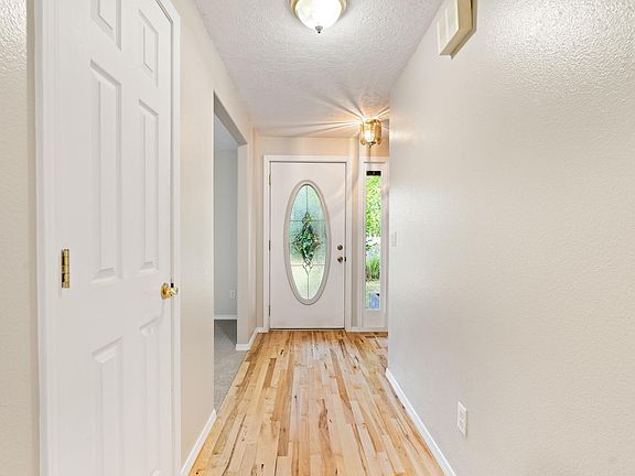 View of front door from kitchen
