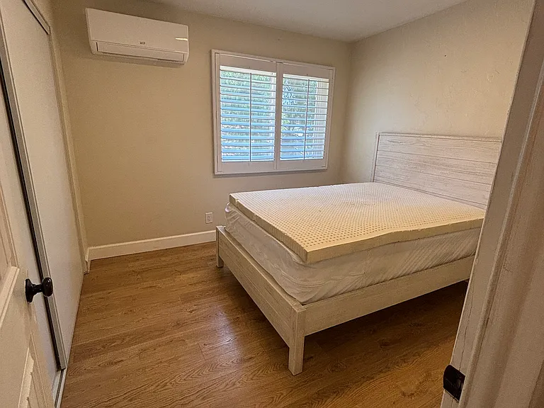 Bed in photo will be removed. Queen Size Bed fits comfortably