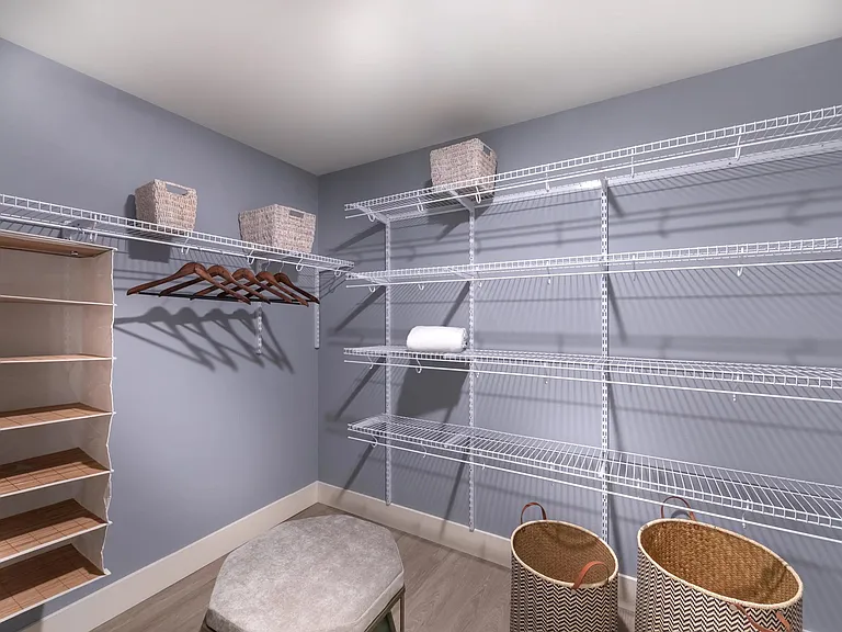 Oversized closet with ample shelving for organized storage.