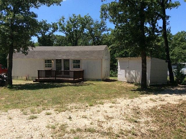 Front view with storage building. 