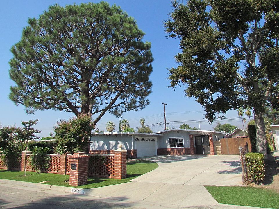 Street view. Custom brick work. A lot of shade. Large driveway.