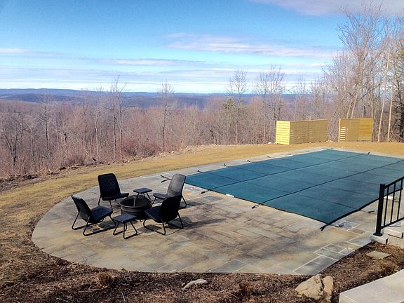 fire pit next to pool