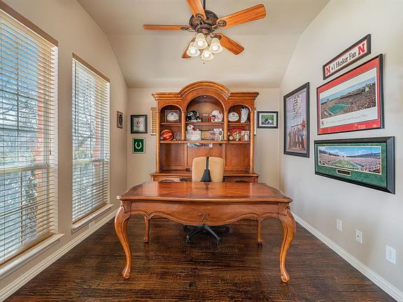 Work from home?  This sunny office area has hand-scraped hardwoods and double private doors.