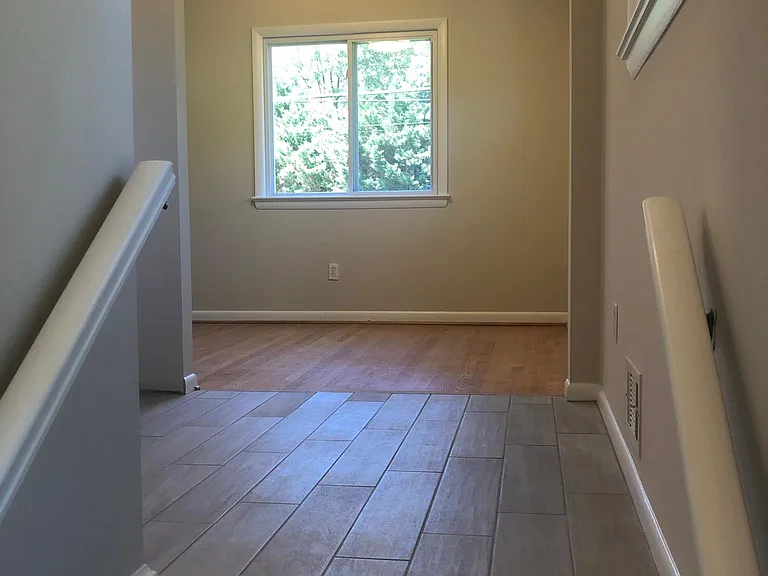Landing area looking into kitchen and dining room