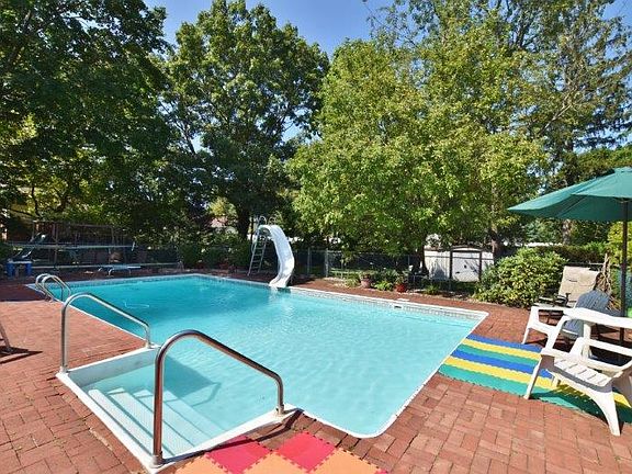 Pool has slide & diving bd.