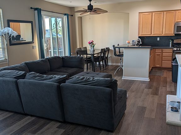 View from entrace area shows how spacious living room/dining room area is, and patio door