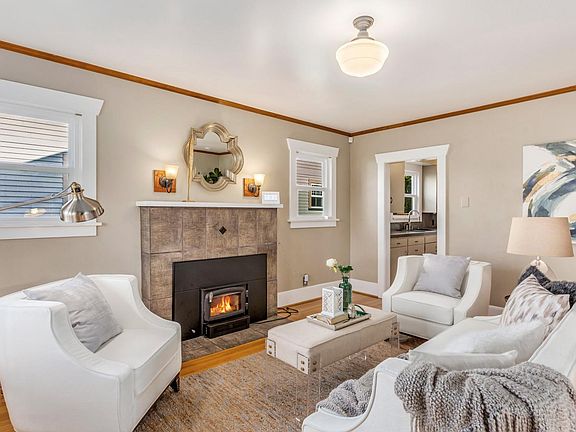 Living room with wood burning fire place