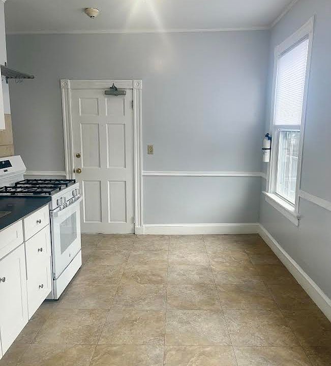 The backdoor leads from the parking area, up the back stairs and into the kitchen