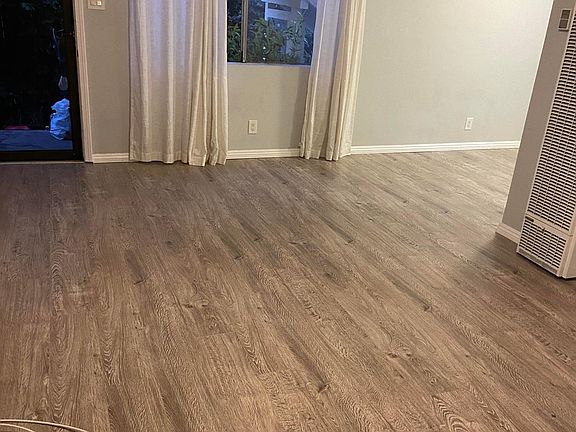 Living room - includes paddle fan and curtains