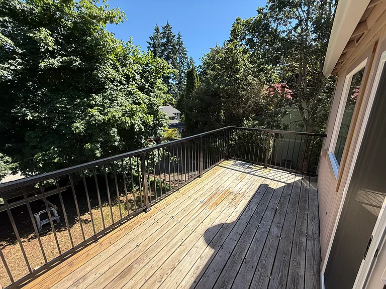 Mature trees afford easy privacy on the deck.