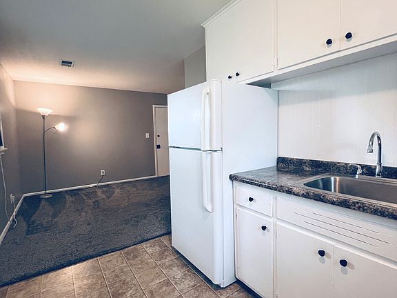 Bright Galley Kitchen with lots of storage.