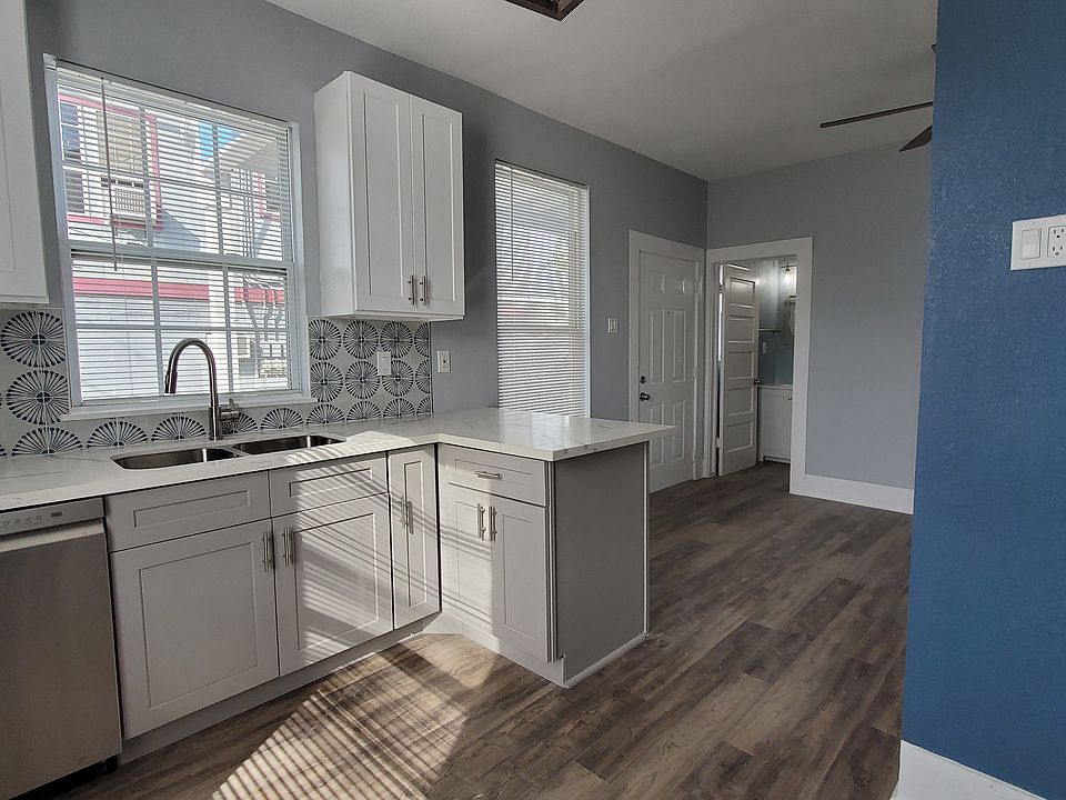 Kitchen, breakfast bar, and living room all flow together nicely