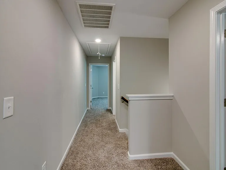Hallway Upstairs with view of Entry to Primary Bedroom. Split Bedroom Layout
