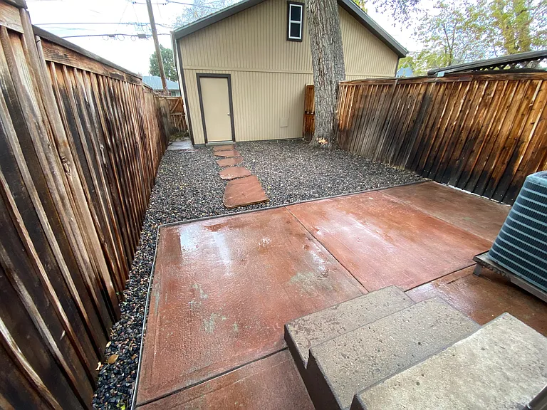 Patio with xeriscaped backyard.
