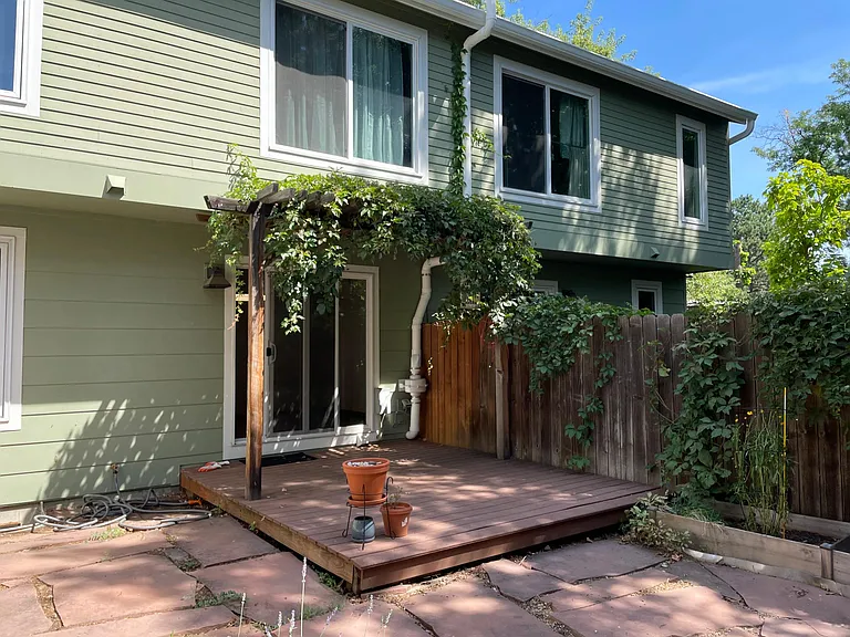 Private fenced backyard with trex deck.