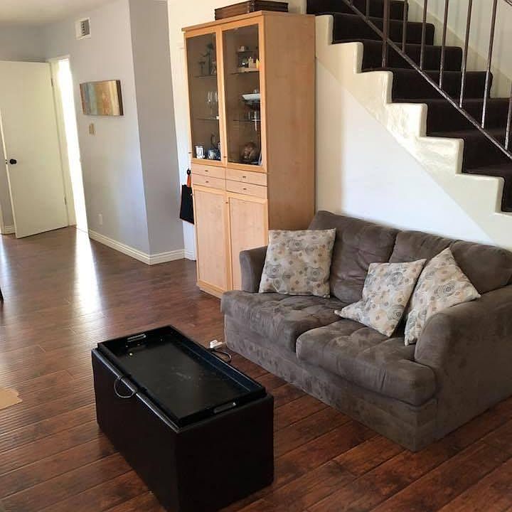 Gorgeous, easy-to-clean dark wood laminate throughout.