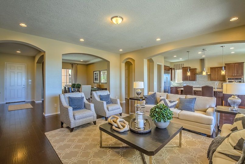 The gathering room has beautiful wooden flooring with lots of space to relax and entertain family an