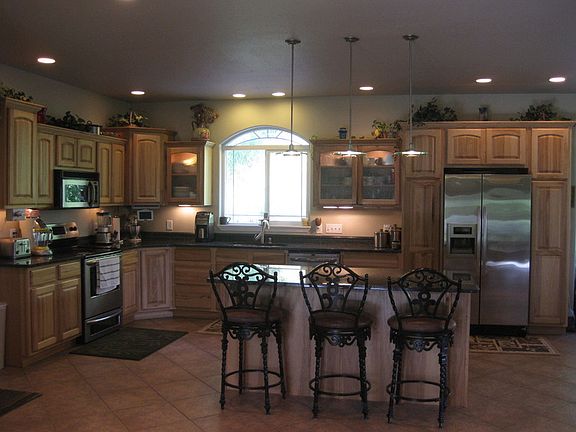 Kitchen
						:
						Stainless steel appliances, Granite tops,lighting in and under Hickory Cabinets