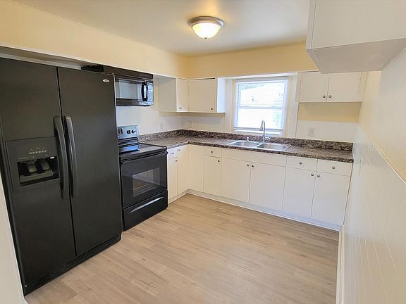 Kitchen opens into living room great for entertaining or family movie night.