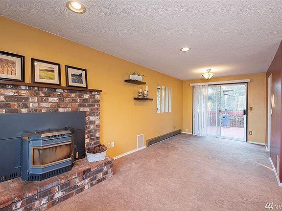 Dining room off the kitchen and living room, slider leads to expansive back deck.