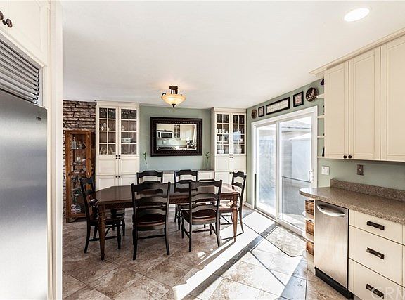 Dining room with custom built-in's that match kitchen cabinets