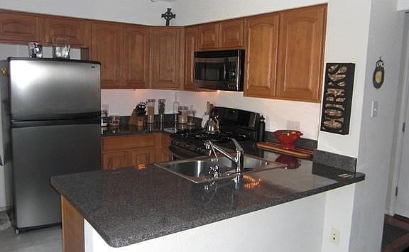Kitchen w/30" raised panel cabinets & dual sink