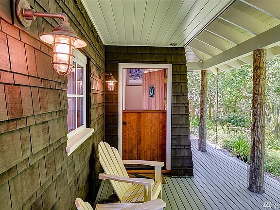 Entry door is a dutch door, notice the hand dipped cedar, ribbon, siding.  