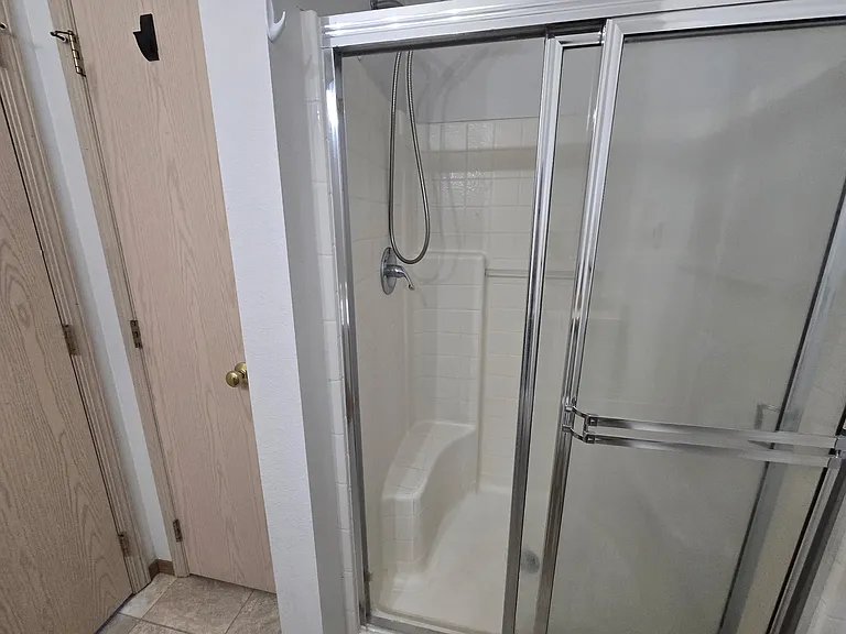 Master shower & linen closet