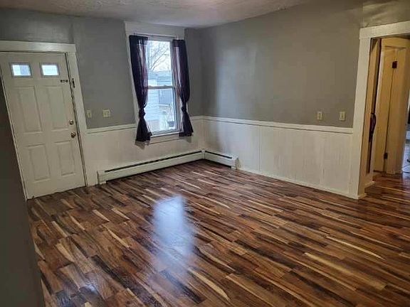 Private entrance opens to the large kitchen/dining area, which has updated paint and new flooring.