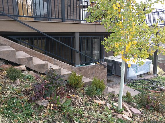 Separate entrance to lower level of house with hot tub