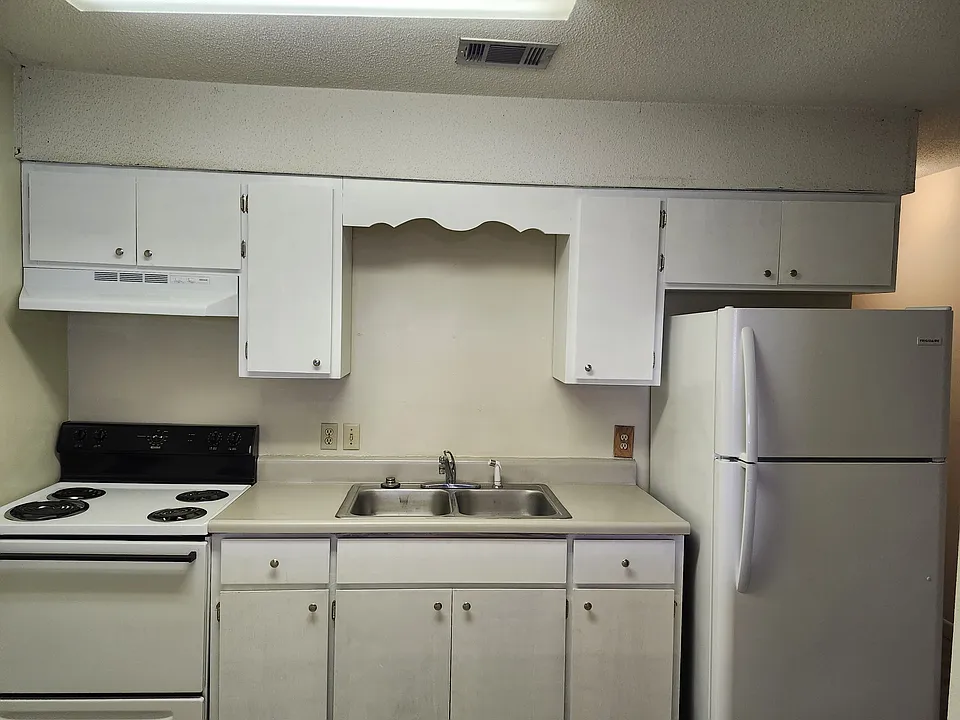 Kitchen with newly refinished cabinets