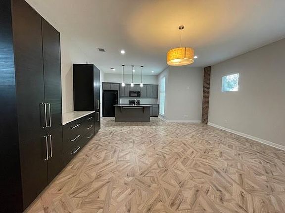 Unfurnished living room with recessed lighting