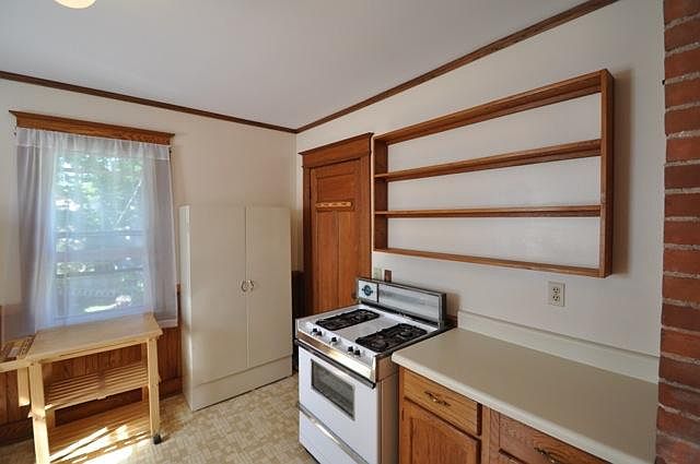 Formal kitchen with dishwasher and disposal.