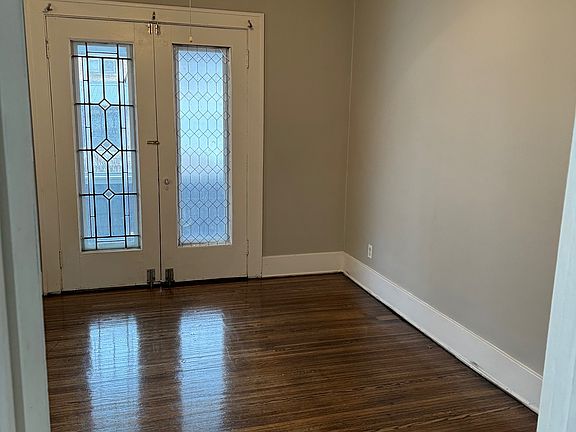 Main bedroom with an attached front porch to enjoy the nice weather