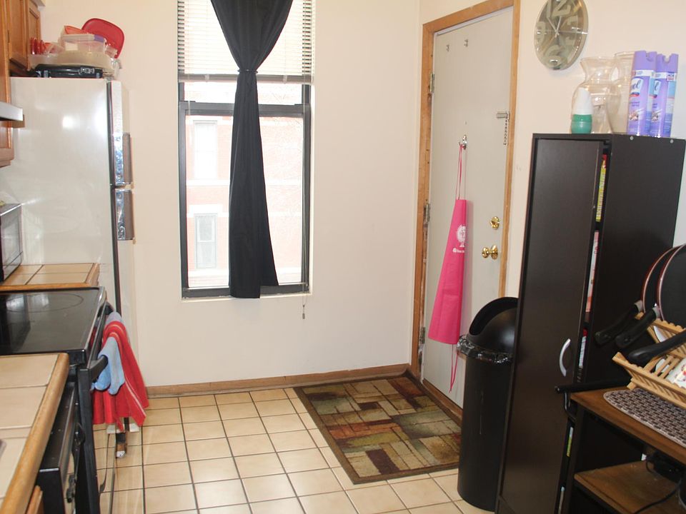 Kitchen (back entrance) leads to hallway exit.