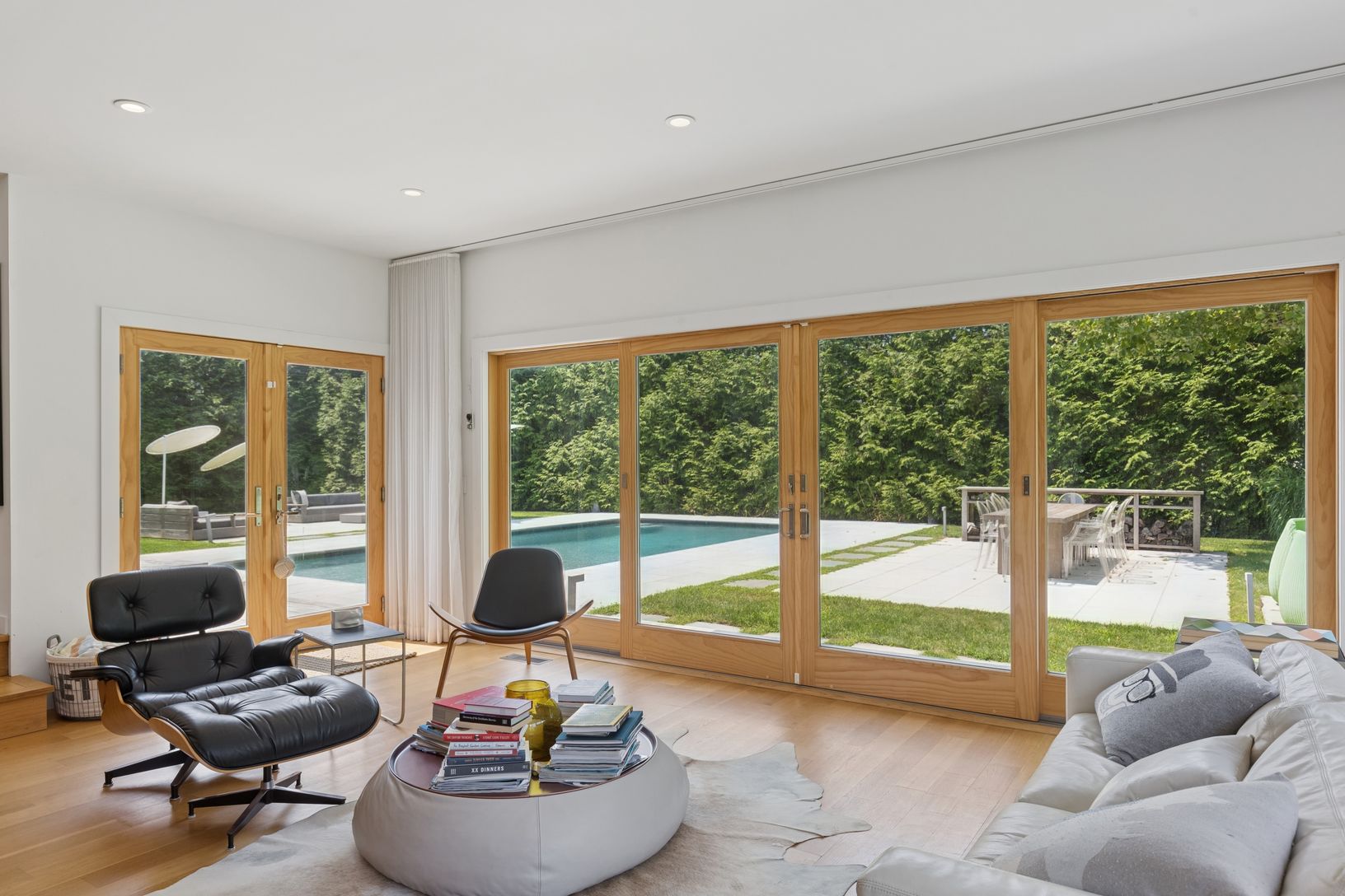  great room off kitchen with glass doors to pool deck