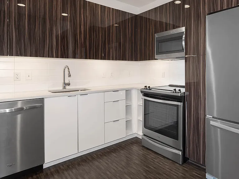 Kitchen with Quartz Countertops and Stainless Steel Appliances