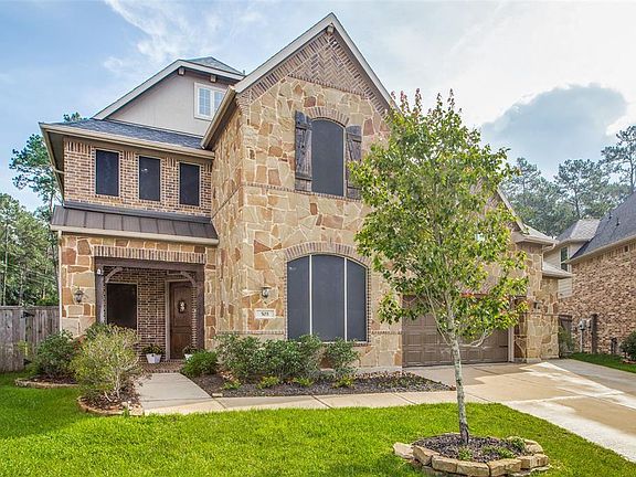 Gorgeous stone and brick adorn this lovely home